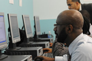 Man at computer job training